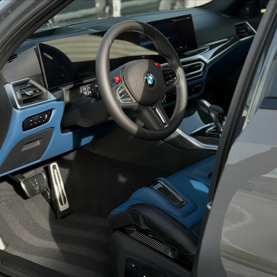 BMW interior after full HENOX interior detail — spotless dashboard, clean leather, and dressed surfaces